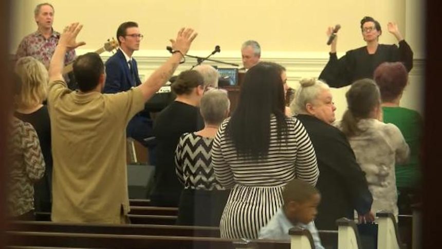 A Louisiana pastor defies a state order and holds a church