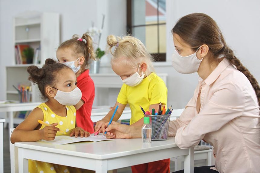 Teacher and students during COVID