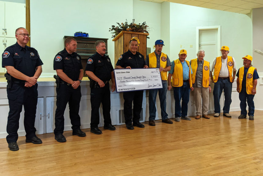 Lava Hot Springs Lions Club present Bannock County Sheriff with check for $14,625.
