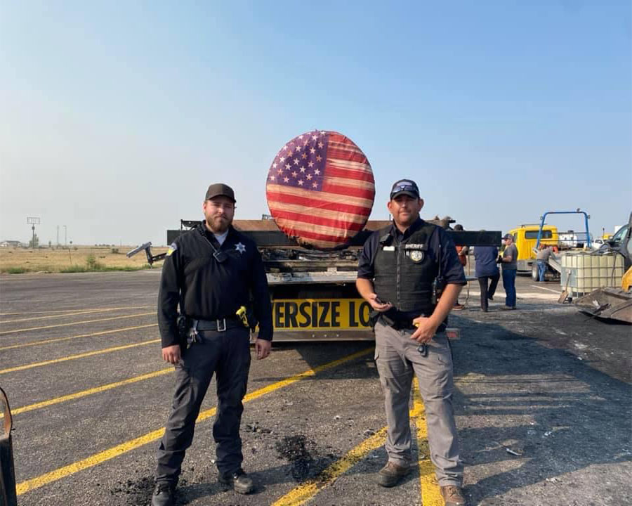 Clark county deputies next to flag cover