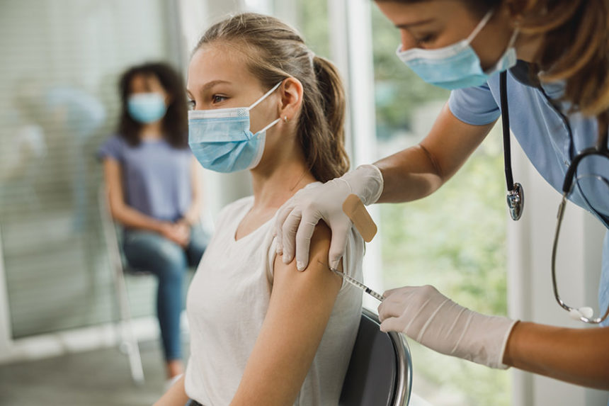 teenager getting vaccine